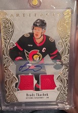 2025-26 Upper Deck Artifacts - Brady Tkachuk #126 Gold Auto Material /45