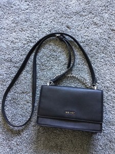 small black purse with chain strap