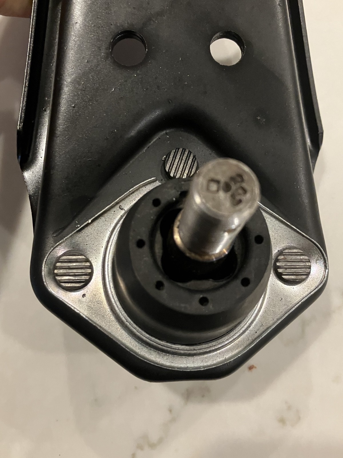 Lower control arms 1967 Ford Mustang with black metal housing, circular roller bearing, and embossed MOOG K8121 label.