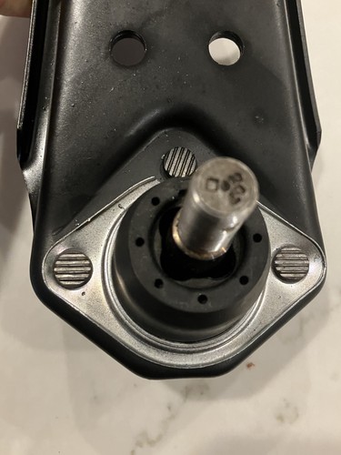 Lower control arms 1967 Ford Mustang with black metal housing, circular roller bearing, and embossed MOOG K8121 label.