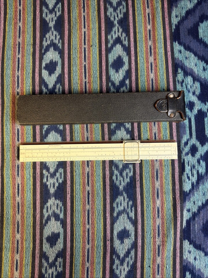 A classic K&E Polyphase slide rule with leather case — Keuffel & Esser is THE prestige name in American slide rules, NASA-era provenance baked in.