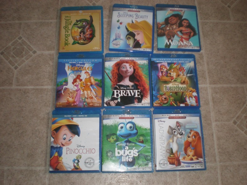 Lot of 9 Disney & Pixar Blu Ray DVDs Tobacco Odor Brave Tramp Jungle Moana Robin
