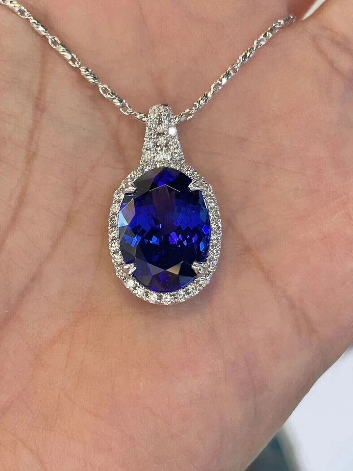 Colgante con halo de zafiro azul natural corte ovalado de 2,0 quilates chapado en oro blanco de 14 quilates cadena de 18" Foto 2 de 4