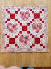 Handmade quilted table topper Valentine's Day red, pink, white