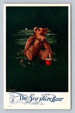 Postcard The Sea-Shore Bear signed Charles Twelvetrees teddy bear playing in san