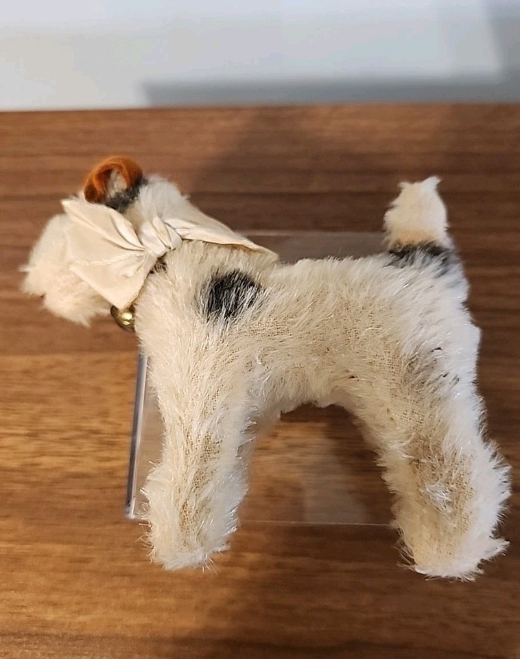STEIFF: A rare vintage mohair Foxy Fox Terrier dog with glass eyes and red leather collar. Circa 196