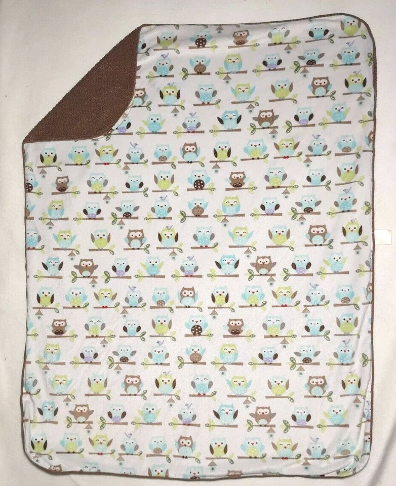 Manta bebé vieja marrón recién nacido en hoja de rama de árbol verde azul usada Foto 2 de 4