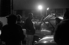 Henry Liddon looks as maintenance crew work his Ford Escort RS 160- Old Photo 1