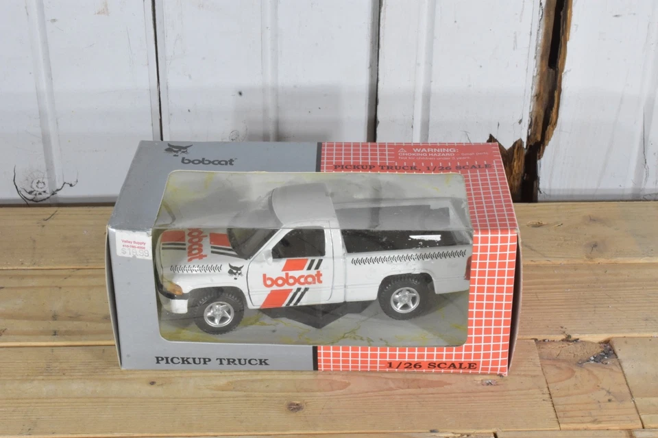Camioneta de servicio ERTL BOBCAT DODGE RAM 1500 PICKUP EN CAJA 1/26 Foto 2 de 4