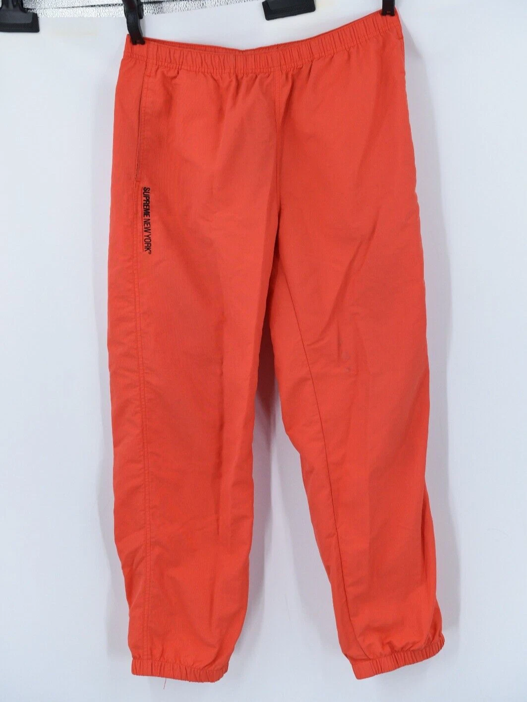 Pantalon d'échauffement Supreme New York FW22 homme moyen   résistant à l'eau   orange