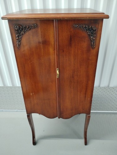 antique wood sheet music cabinet w/swinging doors. Red Cherry finish.