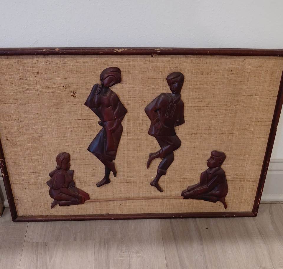 A hand-carved 3D folk art wall piece with burlap-textured dancers — 26x17" of genuine mid-century handcraft that looks like a gallery find.