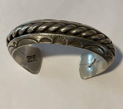 8  Orville Tsinnie (1943-2017) Navajo Hand Stamped Twisted Wire Silver Bracelet