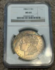 1884 O $1 Morgan Silver Dollar NGC MS64 Rainbow Crescent Toner Obverse