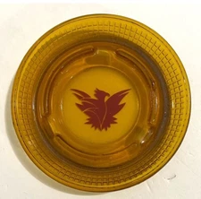 VINTAGE, AMBER ASHTRAY FROM THE THUNDERBIRD HOTEL, 5" IN DIAMETER