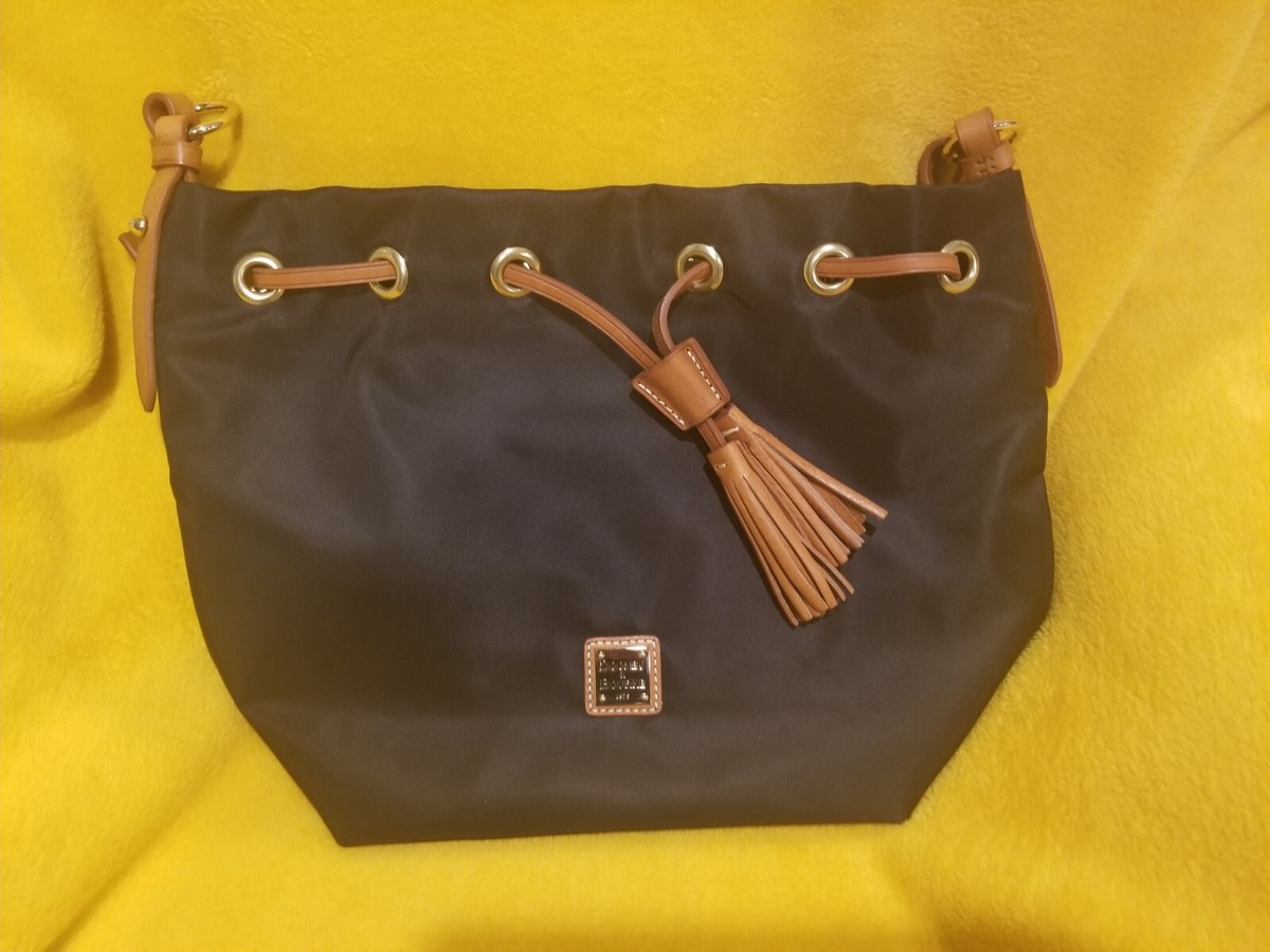 Dooney Bourke black nylon black handbag with bright red/orange inside  lining