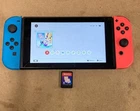Nintendo Switch Console with Neon Blue/Neon Red Joy-Con Controllers + Game
