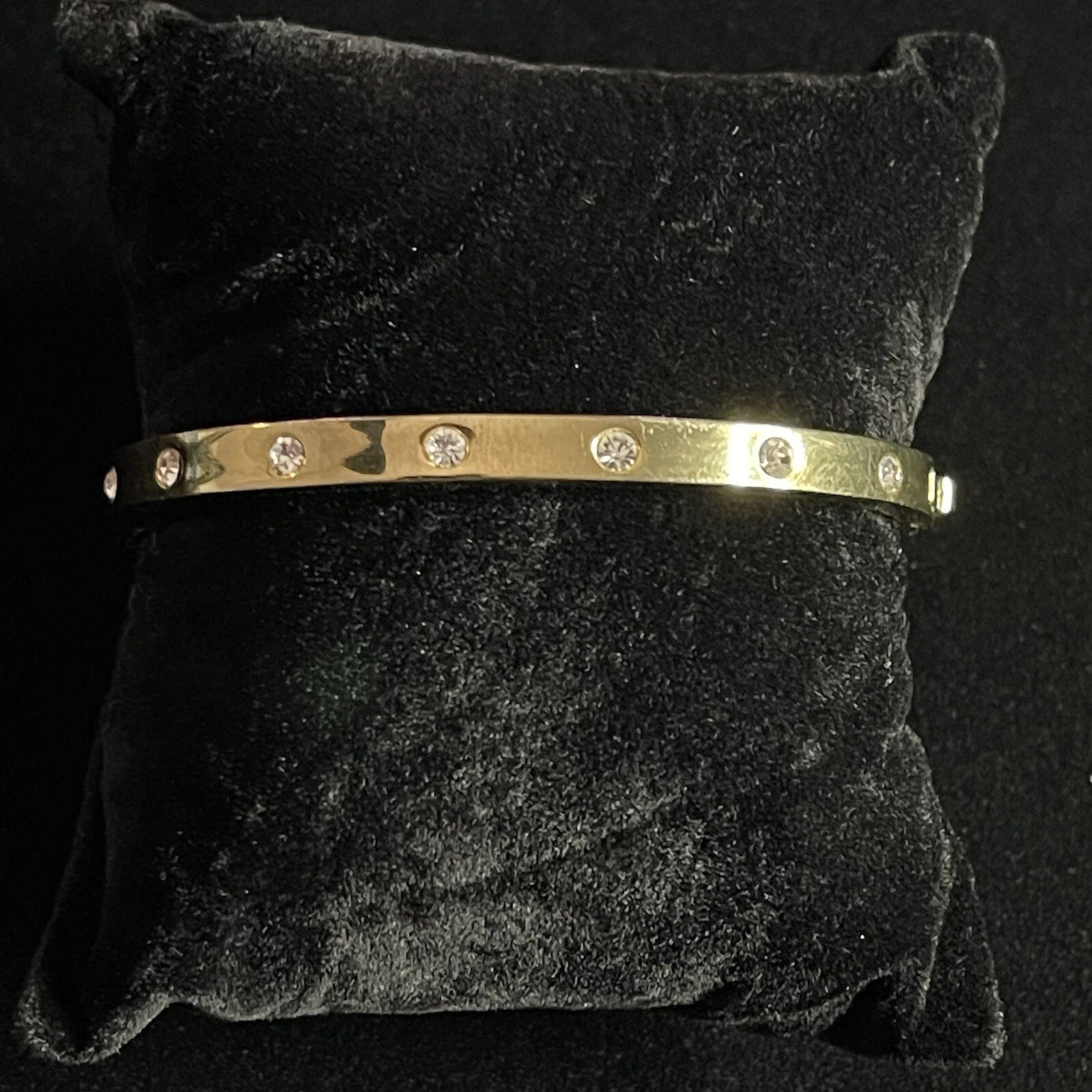 Bracciale Kate Spade tono oro zirconi incernierati di New York lucido
