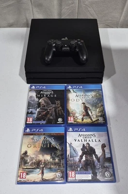 Console PS4 PRO 1 To + 4 jeux Assassin's Creed - Photo 1/4