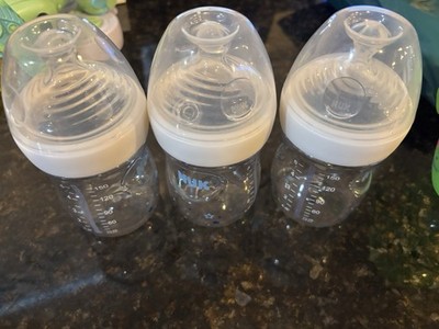 THREE NEW NUK SIMPLY NATURAL 5-OZ BABY BOTTLES 3 STAGE 1 AND 4 STAGE 2 NIPPLES