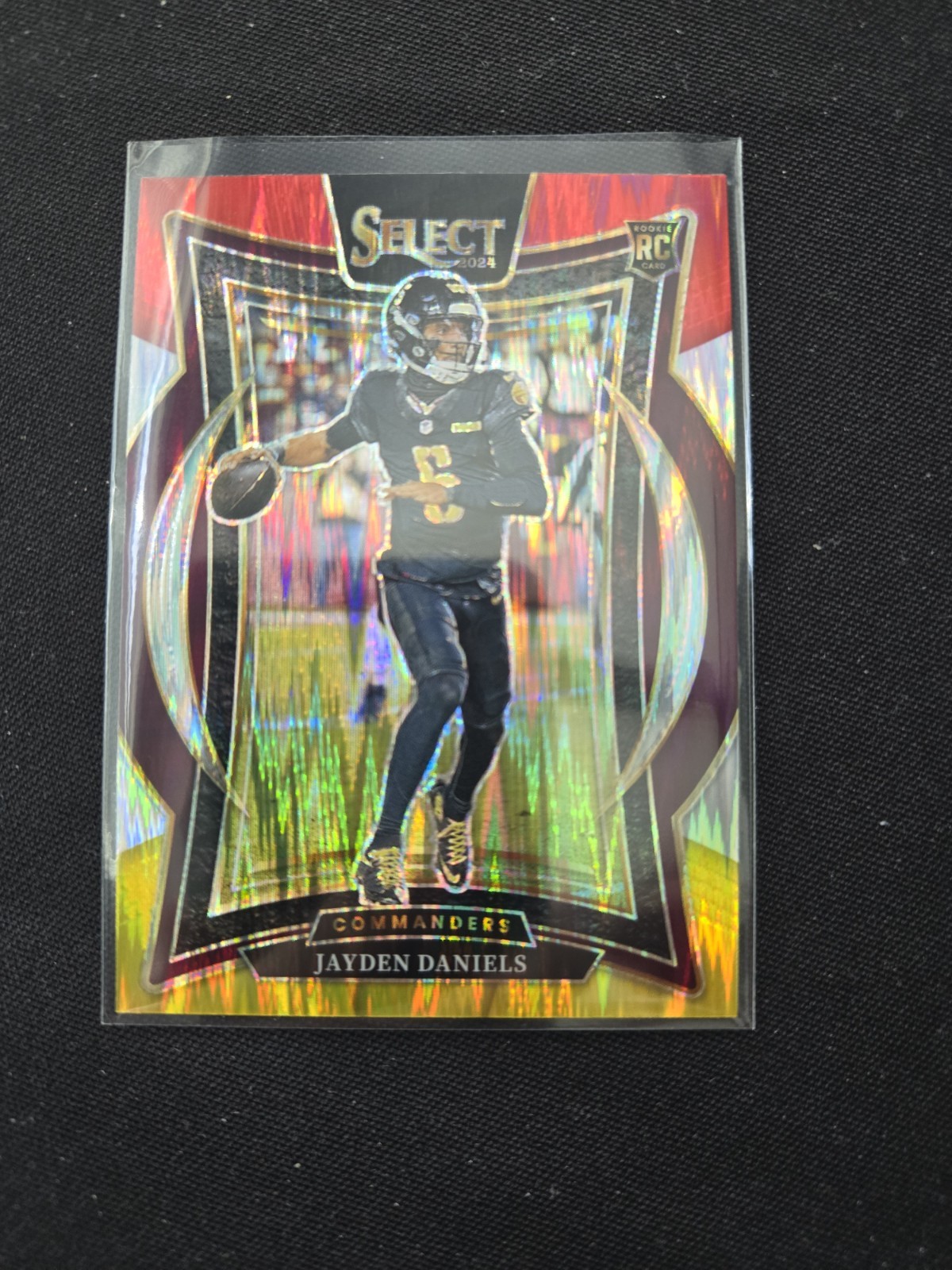 2024 Panini Select Football Jayden Daniels RC Red & Yellow Shock Prizm #26