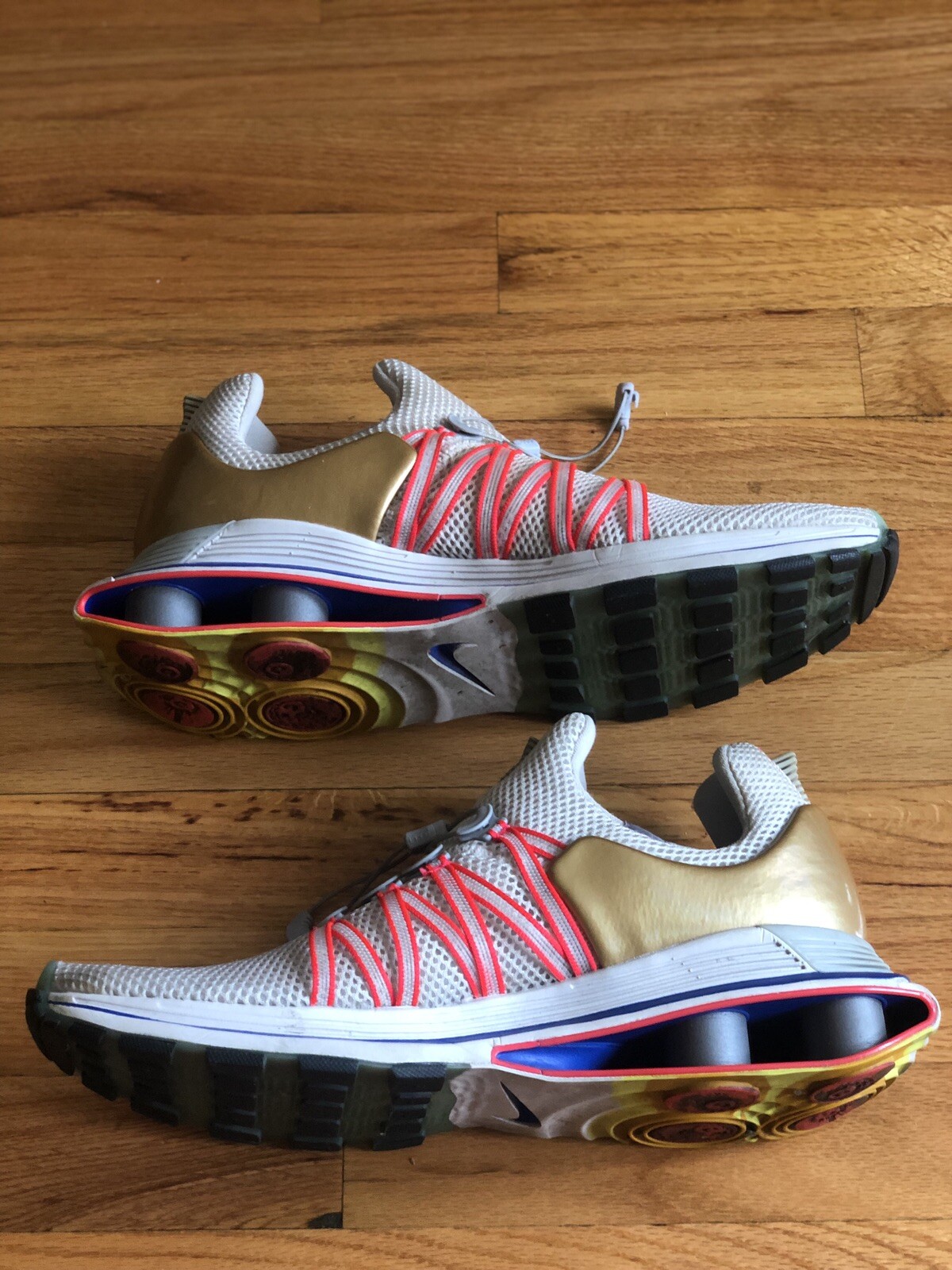 nike shox gravity vast grey metallic gold