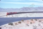 Original Slide- KCS Kaiser Steel Co. U30C 1032 & Train At Desert Center, CA 5/75