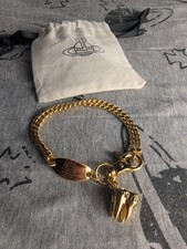Vivienne Westwood Gold Chained Bracelet with Orb Plate and Tooth Charm