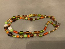 A stunning multi coloured bead necklace. Worn once. In gift purse. Great buy!