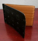 MCM BIFOLD ID/CARD HOLDER. LEATHER . BLACK EXTERIOR. BEIGE INTERIOR. KOREA