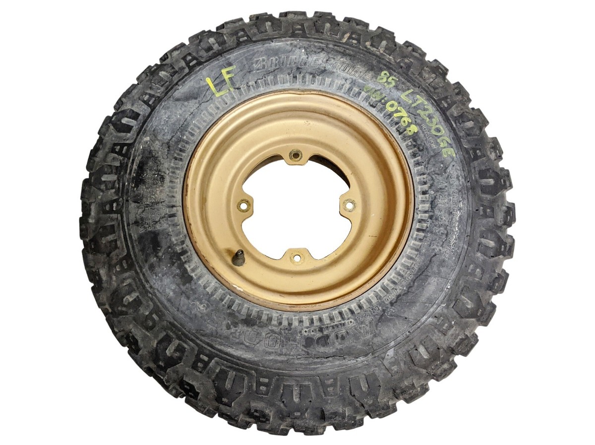 85 Suzuki LT230GE LT230 230 GE Quadrunner Left Front Wheel