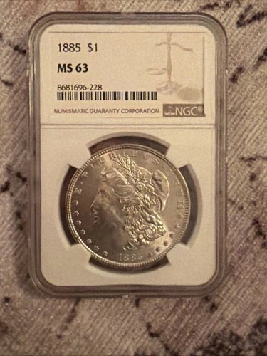 1885  MORGAN SILVER DOLLAR NGC MS63  #091