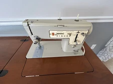 SInger Zig-Zag sewing machine with built-in table. Excellent condition.