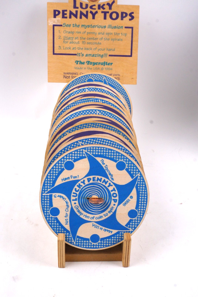 Hand-crafted 1994 wooden spinning tops engineered specifically to create hypnotic optical illusion patterns — artisan STEM meets pure analog magic.