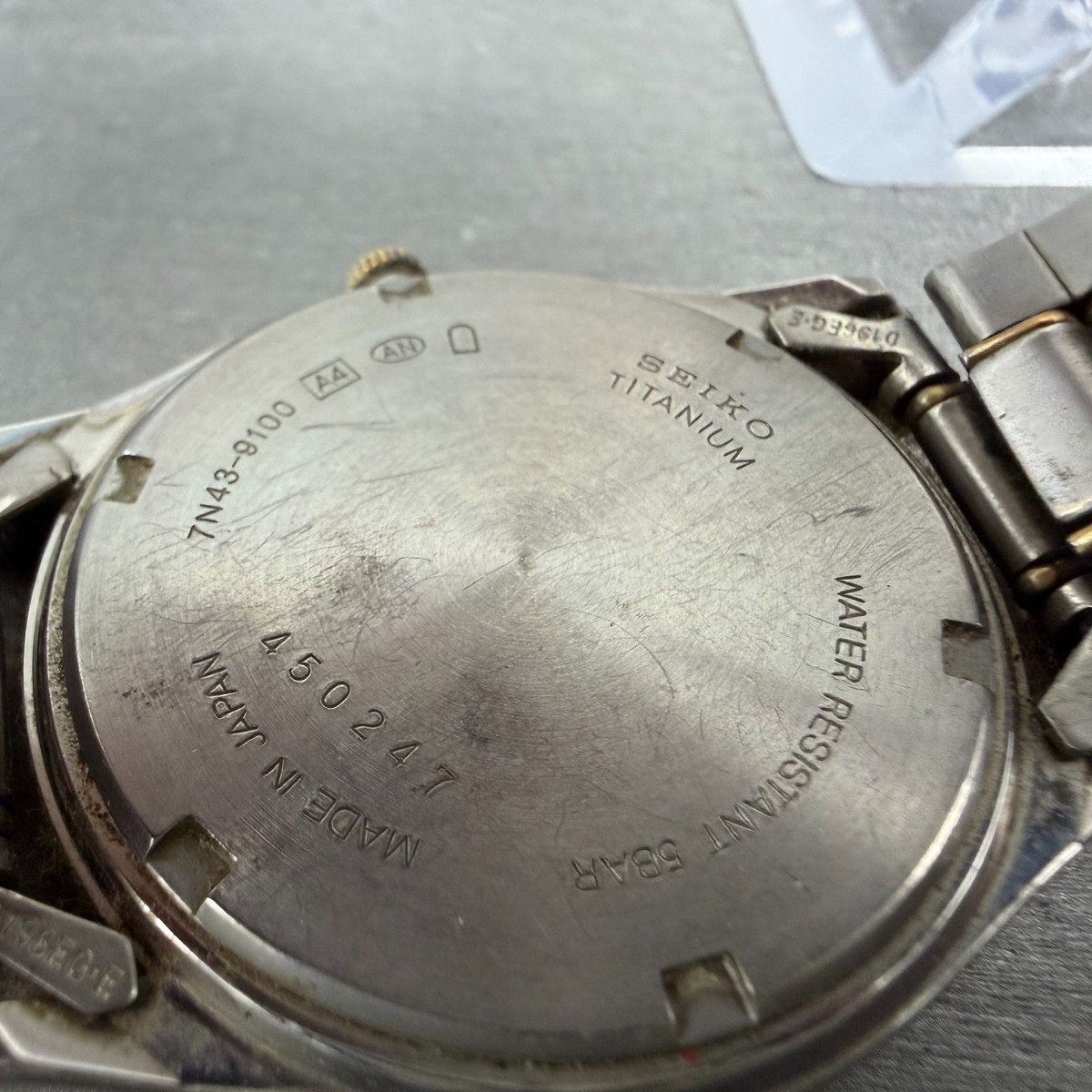 Seiko Watch Men 36mm Champagne Dial Two Tone Titanium Daydate 7N43