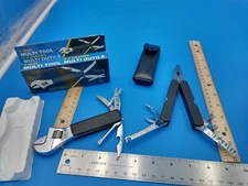 Lot of 2 unused multi-tools. One w/original box, other leather cover. #1031