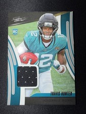 2025 Panini Absolute - Absolute Rookie Materials Travis Hunter #ARM-THR (MEM,RC)