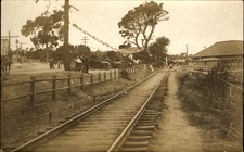 RPPC train track station?~crowd waiting antique cars Japanese lanterns 1904-1918