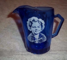 Blue Glass Creamer with Shirley Temple Picture on Side 4 1/2" Tall