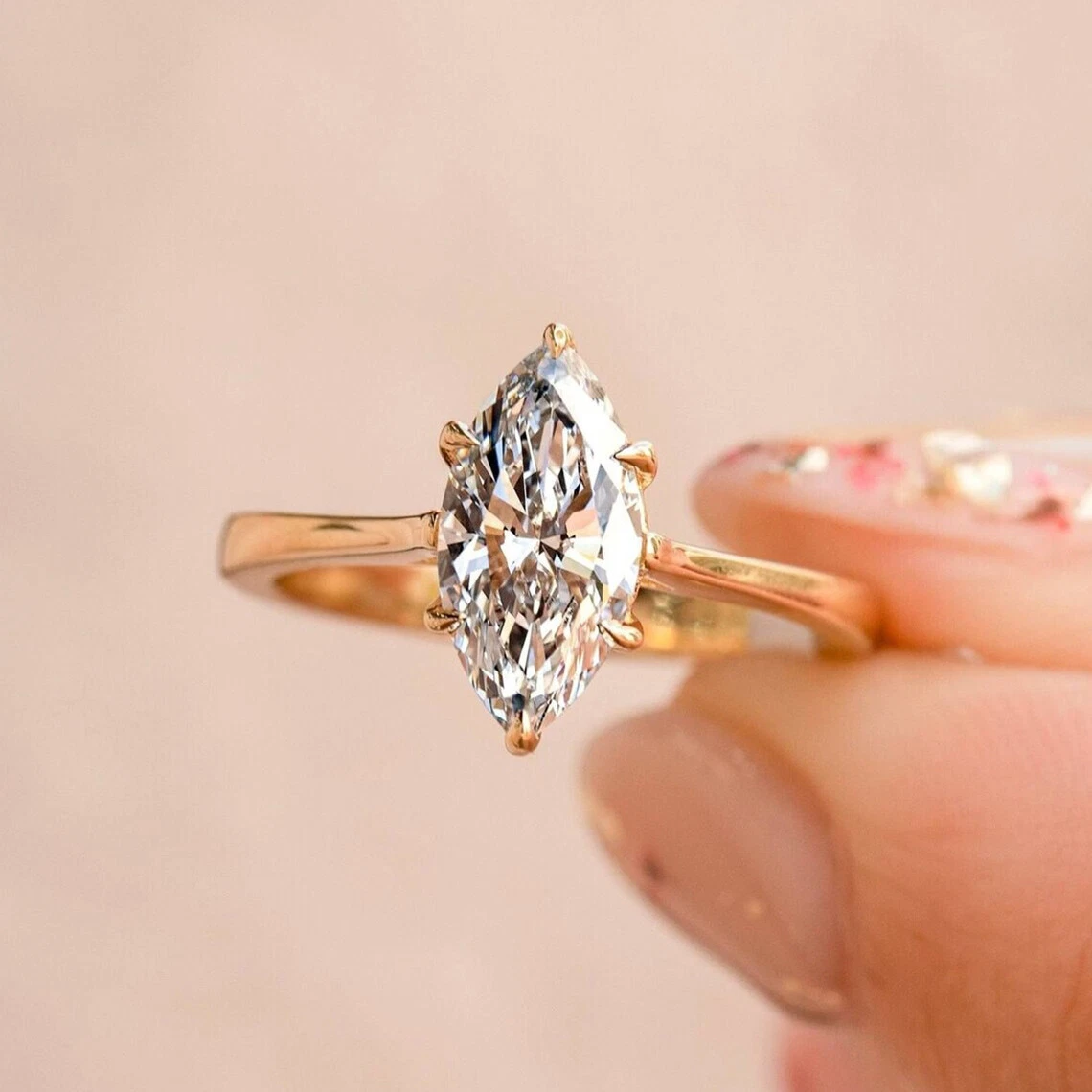 Marquise cut engagement 2024 ring yellow gold