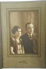 Man and Woman Formally Dressed with Long Pearl Necklace - c.1900s Cabinet Card