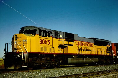 UP 8065 sd9043ac slide _ blue sky in Coverse, WY 10/2003