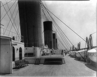 The S.S. OLYMPIC,1911: Deck from 2nd class entrance,bench,ship,life boats