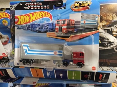 1 :64 Transformers Hot Wheels Track Fleet Optimus Prime Freightliner FL86 Mattel