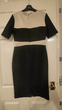 AMY CHILDS COLLECTION BLACK DRESS WITH PALE PEACH PANELS AND HEART NECKLINE....