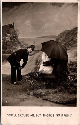 Romantic Couple in Umbrella Policeman Says Its Not Raining RPPC Postcard   16301