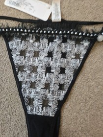 BRAND NEW LISE CHARMEL , BLACK & WHITE STRING THONG SIZE LARGE 