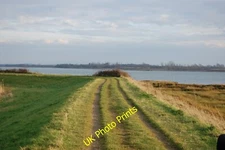 Photo 6x4 Seawall path Goldhanger With Osea Island ahead. c2015