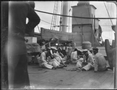 Sailor relaxing on the deck of a ship anchored off Lord Howe Islan- Old Photo