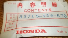 Honda OEM New turn signal holder 33715-128-670  #10568